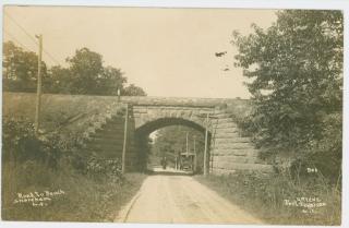1895 stone arch railroad bridge over Woodville Road-- built 1895 and now repurposed as part of the North Shore Rail Trail